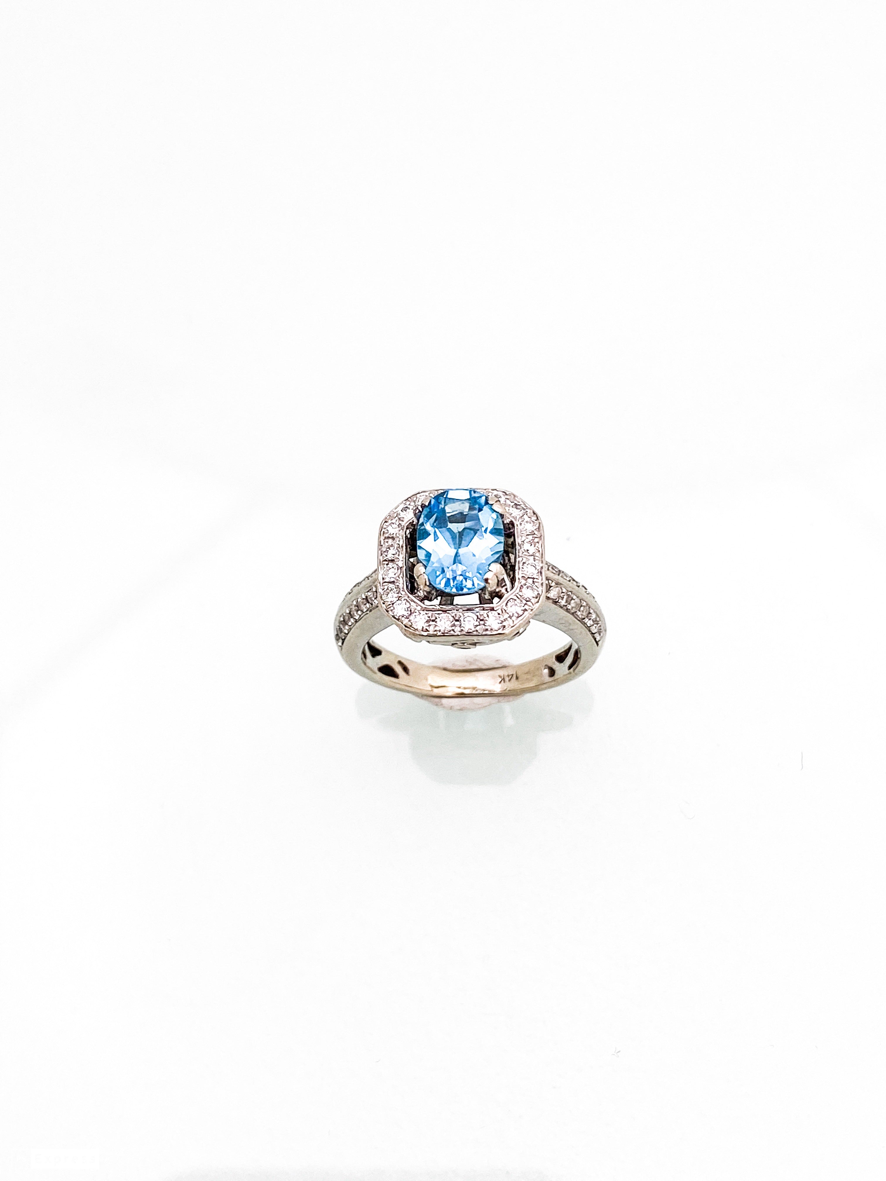 טבעת זהב לבן 14 קארט אבן מרכזית בלו מרין מסביב שיבוץ יהלומים